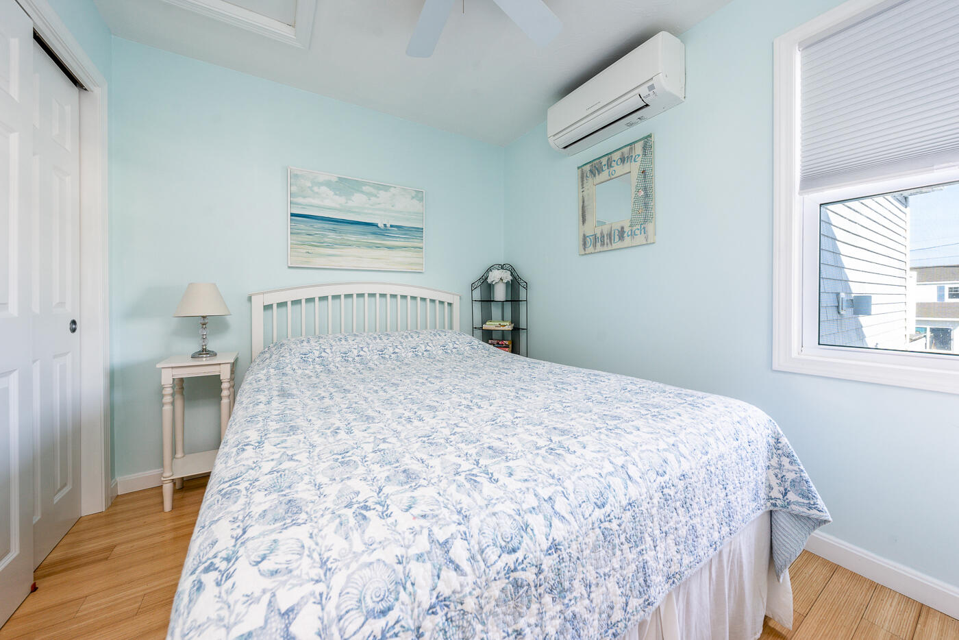 482 Shore Road, Unit 19 Truro, MA 02666 - Photo 10 of 17 a bedroom with a bed and a window