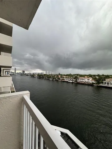 a view of a balcony next to a lake
