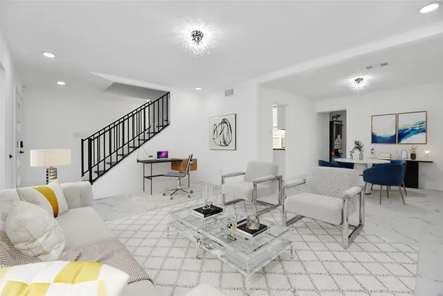 a living room with furniture and a table