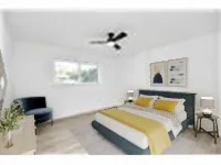 a bedroom with a bed and a chair