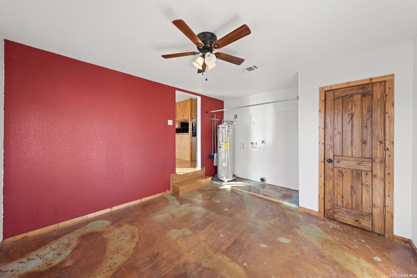 105 Avenue A Center Point Center Point, TX 78010 - Photo 13 of 30 a view of a livingroom with a ceiling fan and window