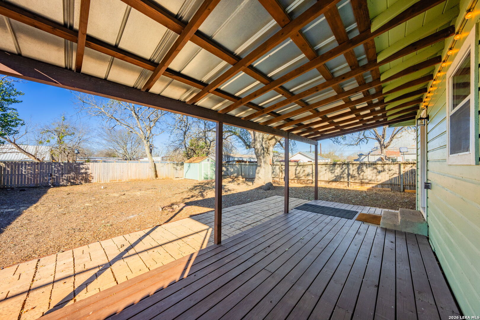 105 Avenue A Center Point Center Point, TX 78010 - Photo 21 of 30 a view of an empty room with wooden floor and a window