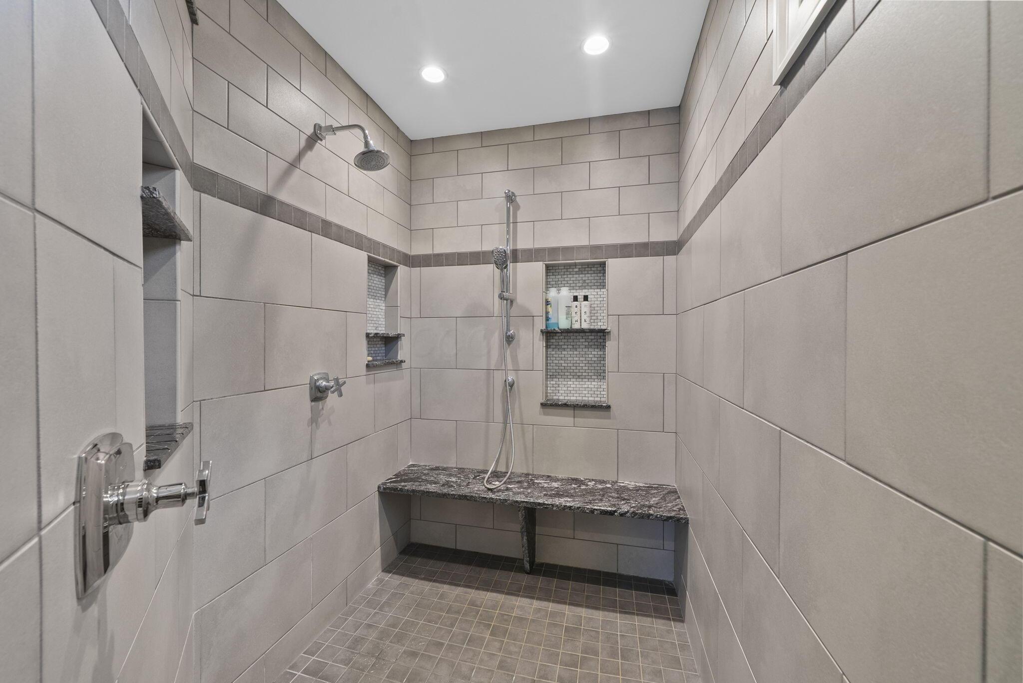1851 Berkshire Road Columbus, OH 43221 - Photo 40 of 125 Walk-in shower with plenty of storage and sitting bench.