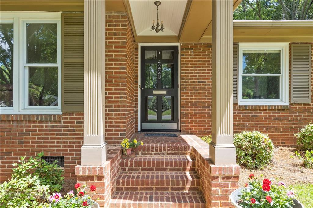 4223 Chelmsford Road Charlotte, NC 28211 - Photo 2 of 33 a front view of a house with a yard