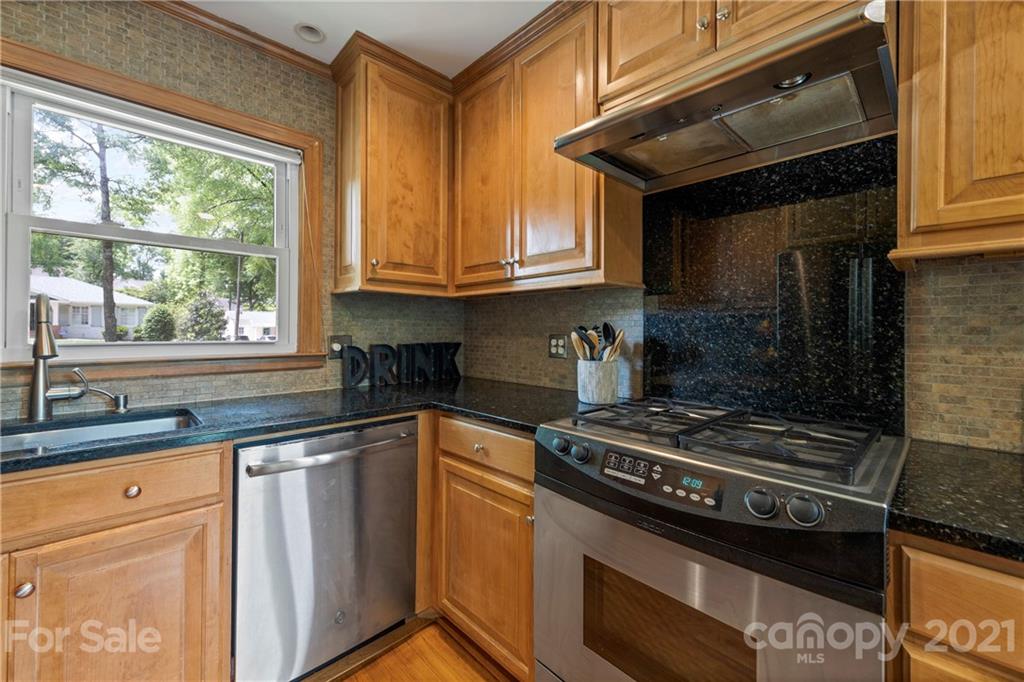 4223 Chelmsford Road Charlotte, NC 28211 - Photo 12 of 33 a kitchen with granite countertop a stove and a sink