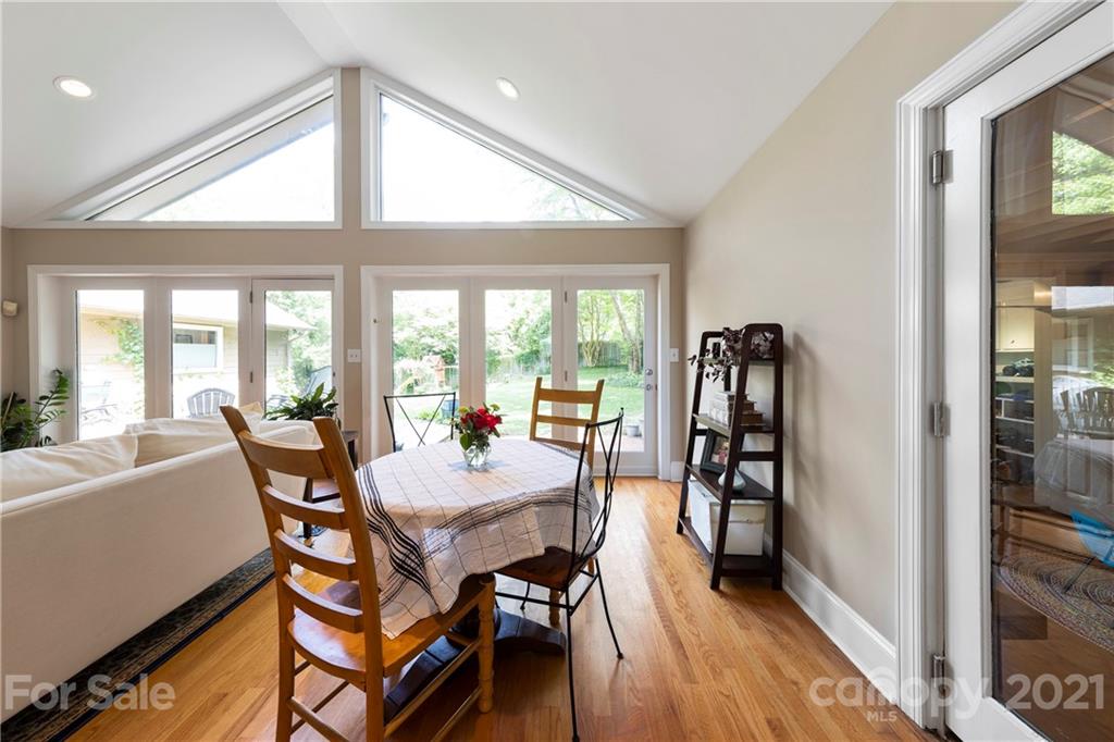 4223 Chelmsford Road Charlotte, NC 28211 - Photo 14 of 33 a view of a dining room with furniture window and wooden floor