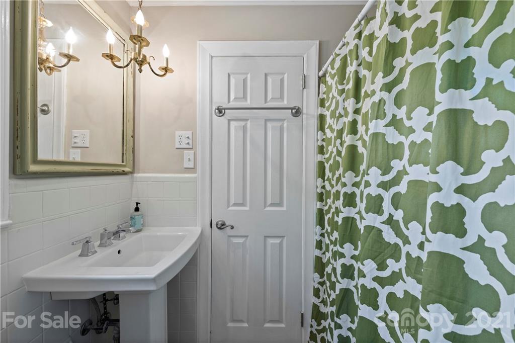 4223 Chelmsford Road Charlotte, NC 28211 - Photo 16 of 33 a bathroom with a sink and a mirror