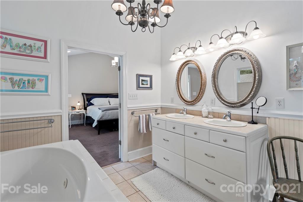 4223 Chelmsford Road Charlotte, NC 28211 - Photo 21 of 33 a en suite bathroom with a toilet and a double vanity sink