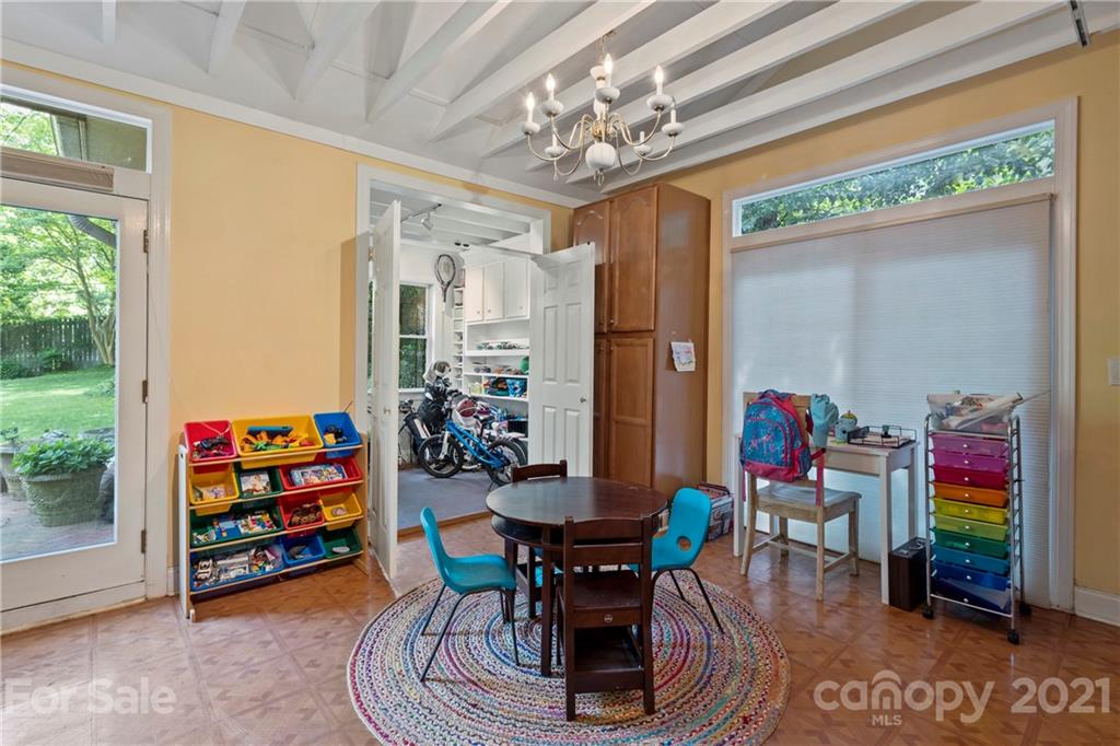 4223 Chelmsford Road Charlotte, NC 28211 - Photo 25 of 33 a view of a dining room with furniture one side kitchen view