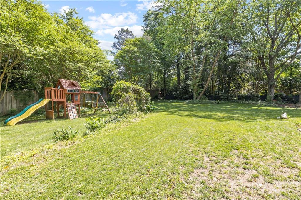 4223 Chelmsford Road Charlotte, NC 28211 - Photo 30 of 33 a view of a swimming pool with a bench and trees around