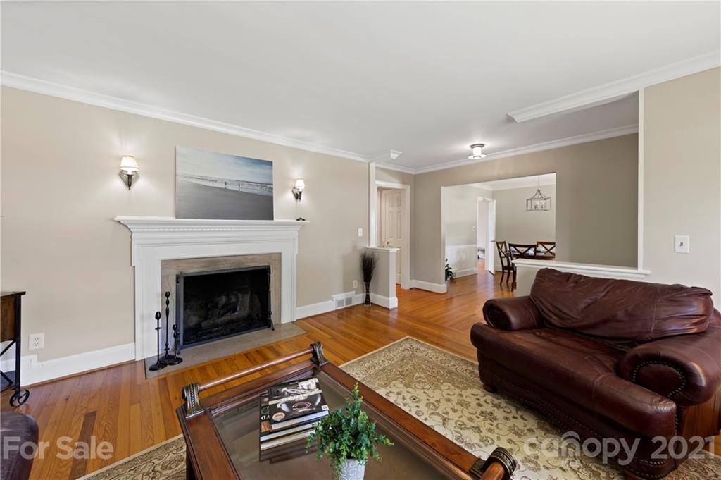 4223 Chelmsford Road Charlotte, NC 28211 - Photo 5 of 33 a living room with furniture and a fireplace