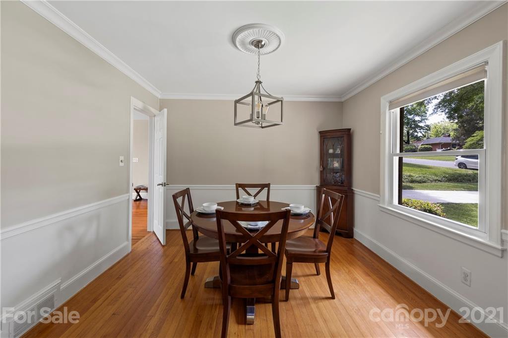 4223 Chelmsford Road Charlotte, NC 28211 - Photo 6 of 33 a view of a dining room with furniture window and wooden floor