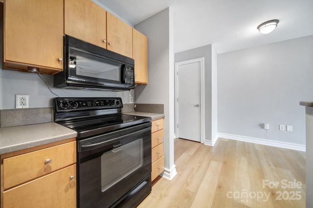 a kitchen with a stove and a microwave