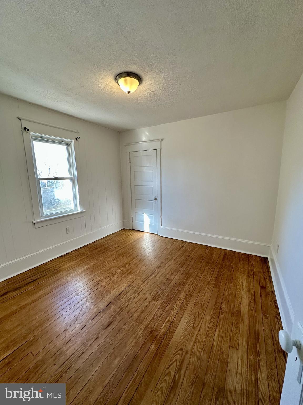 139 Otis Avenue Tuckerton, NJ 08087 - Photo 14 of 27 an empty room with wooden floor and windows