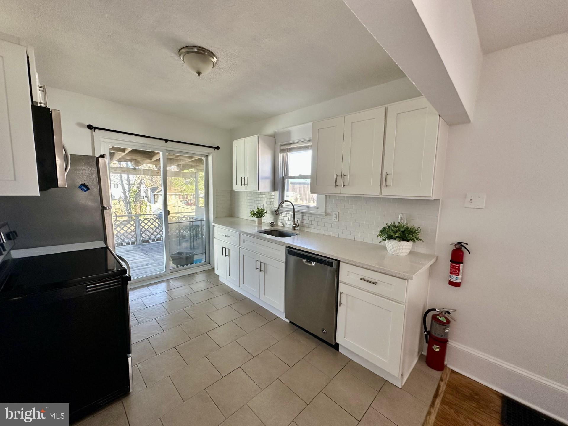 139 Otis Avenue Tuckerton, NJ 08087 - Photo 25 of 27 a kitchen with a sink window and cabinets
