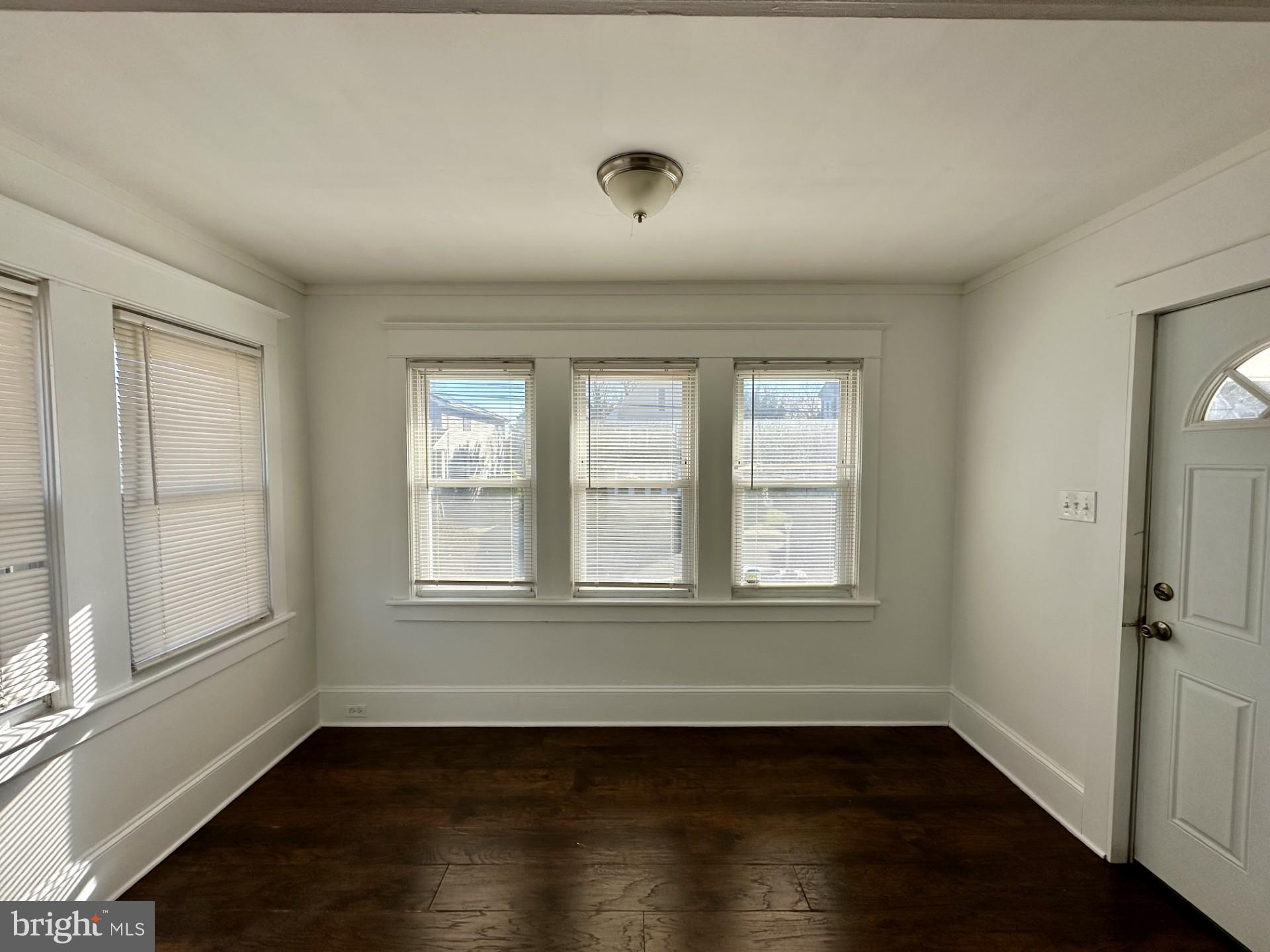 139 Otis Avenue Tuckerton, NJ 08087 - Photo 3 of 27 an empty room with wooden floor and windows