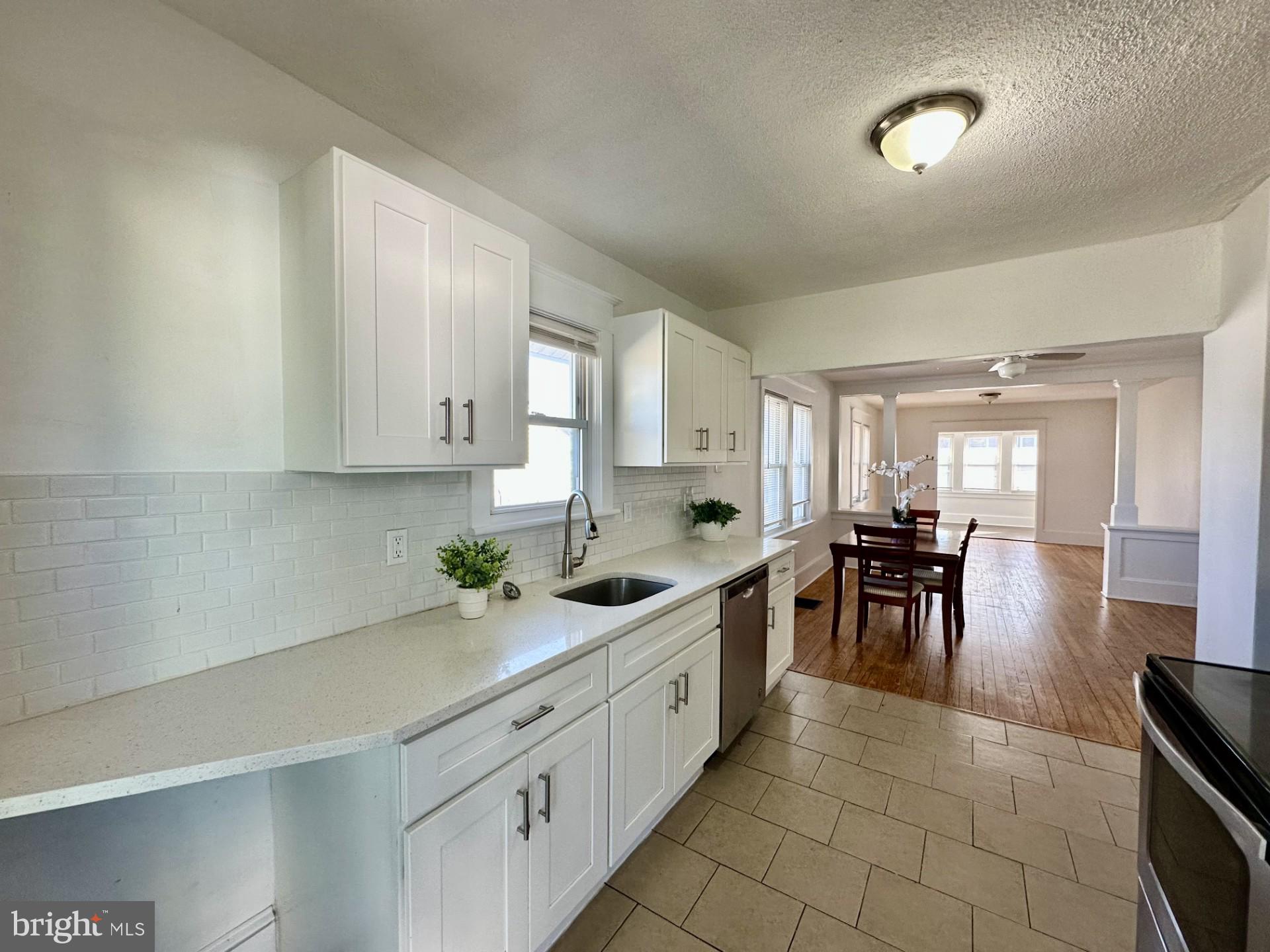 139 Otis Avenue Tuckerton, NJ 08087 - Photo 8 of 27 a kitchen with stainless steel appliances granite countertop a sink and cabinets
