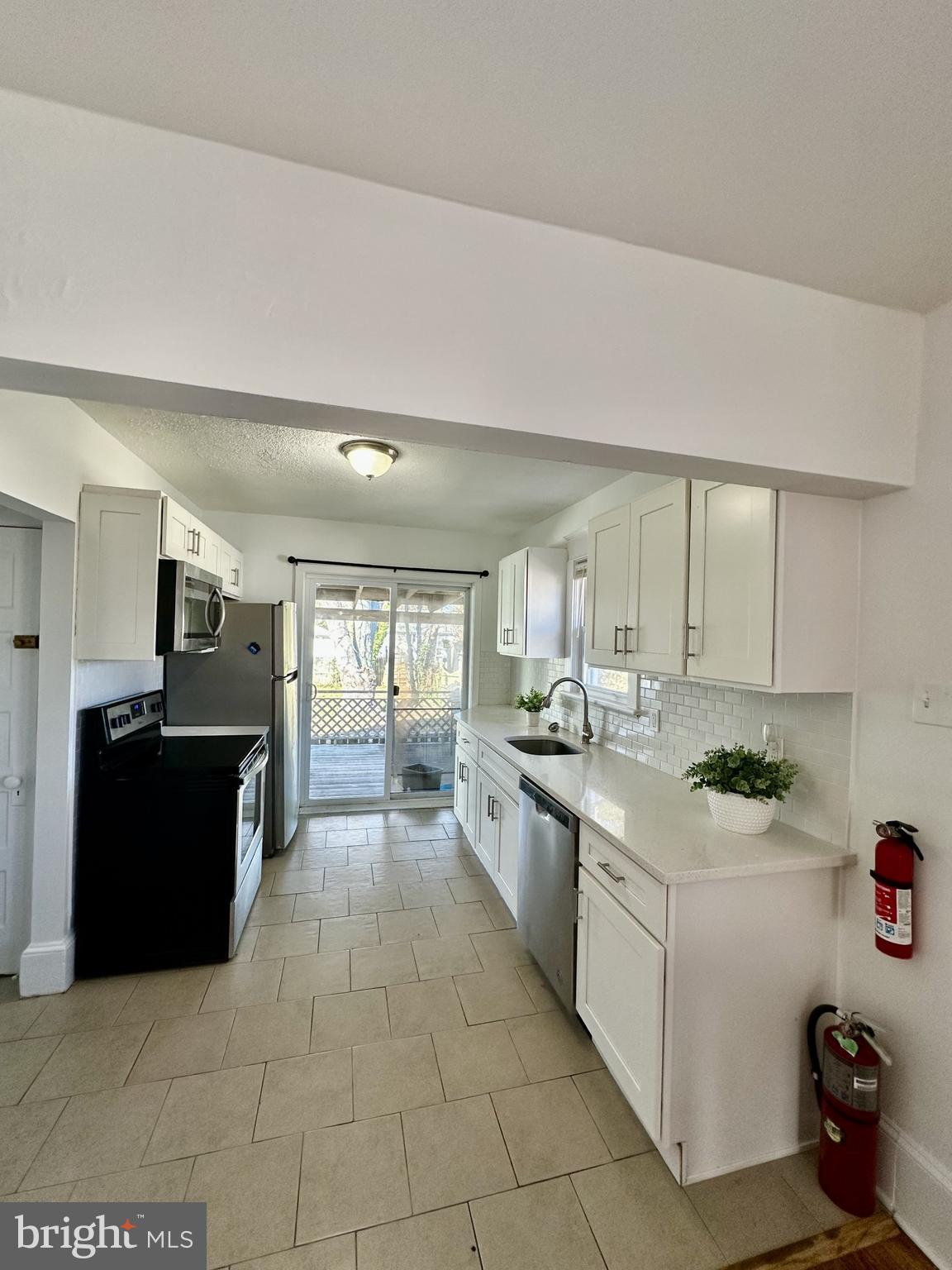 139 Otis Avenue Tuckerton, NJ 08087 - Photo 9 of 27 a kitchen with a sink stove and cabinets