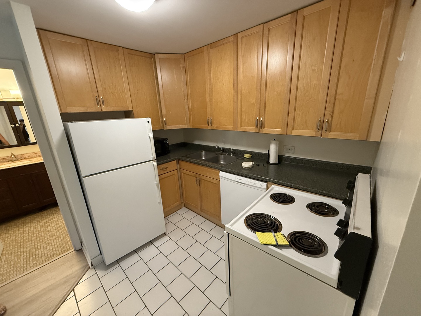 2007 North Sedgwick Street, Unit 202 Chicago, IL 60614 - Photo 2 of 10 a kitchen with a refrigerator sink and cabinets