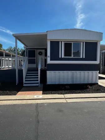 a view of front door and small yard