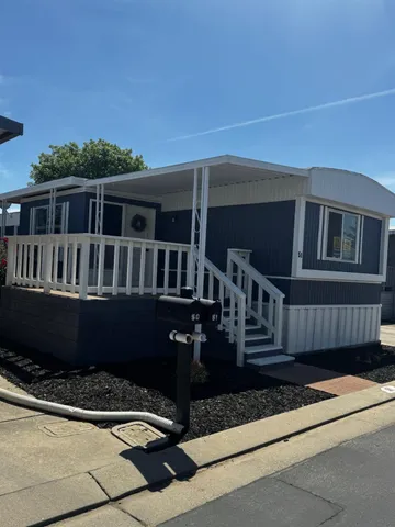 a view of house with a roof deck
