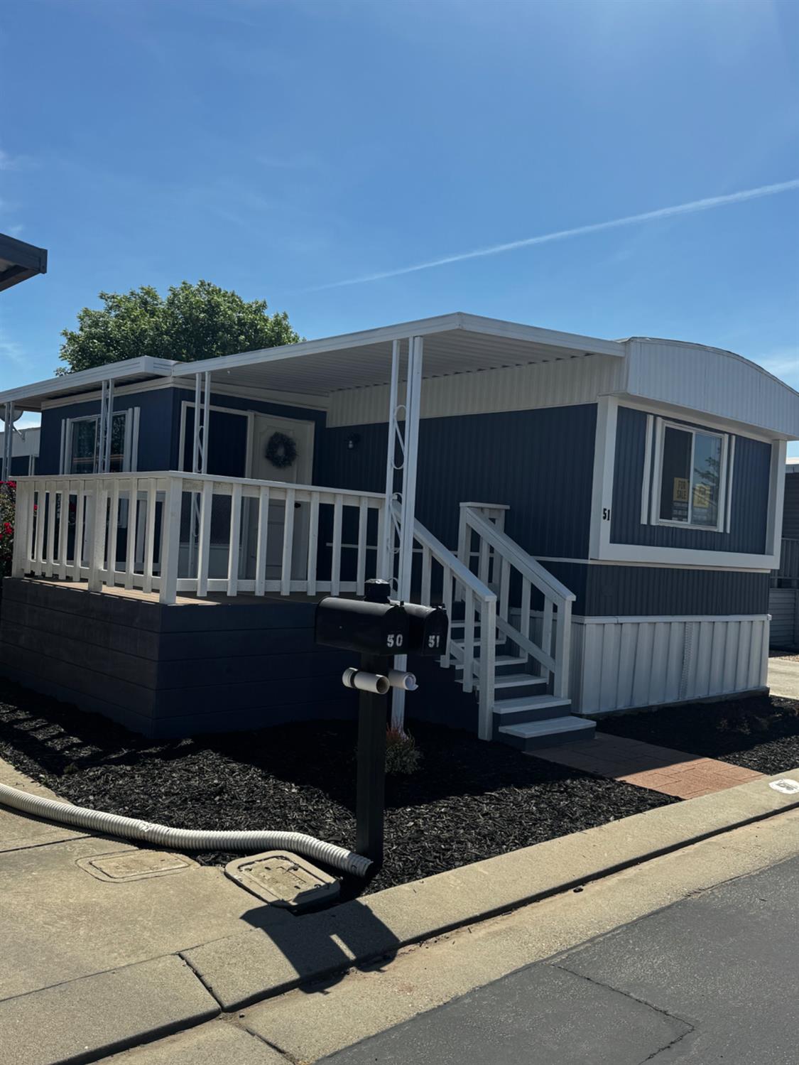 1200 South Carpenter Road, Unit 51 Modesto, CA 95351 - Photo 2 of 20 a view of house with a roof deck