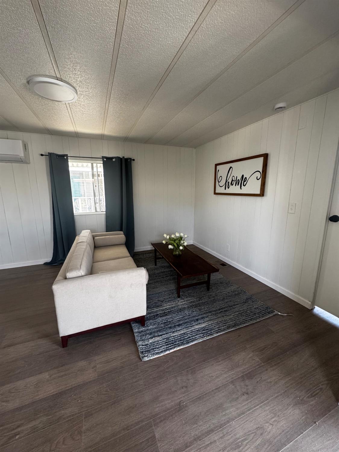 1200 South Carpenter Road, Unit 51 Modesto, CA 95351 - Photo 8 of 20 a living room with hard wood flooring and furniture
