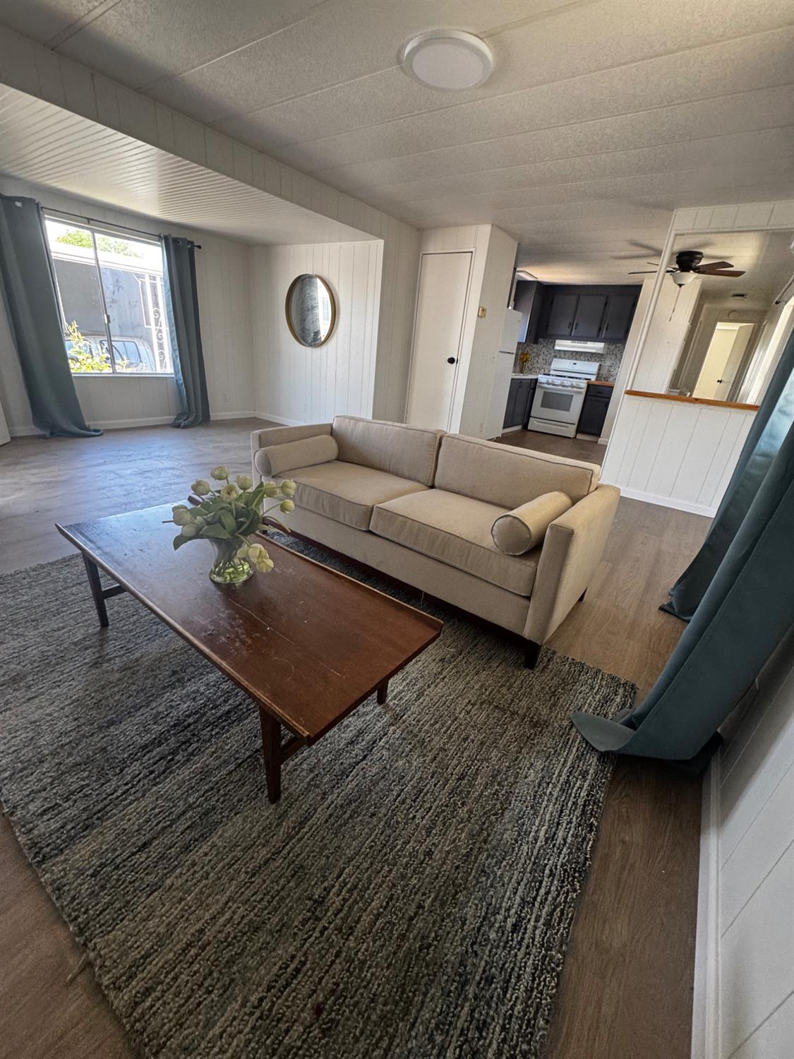 1200 South Carpenter Road, Unit 51 Modesto, CA 95351 - Photo 10 of 20 a living room with furniture and wooden floor