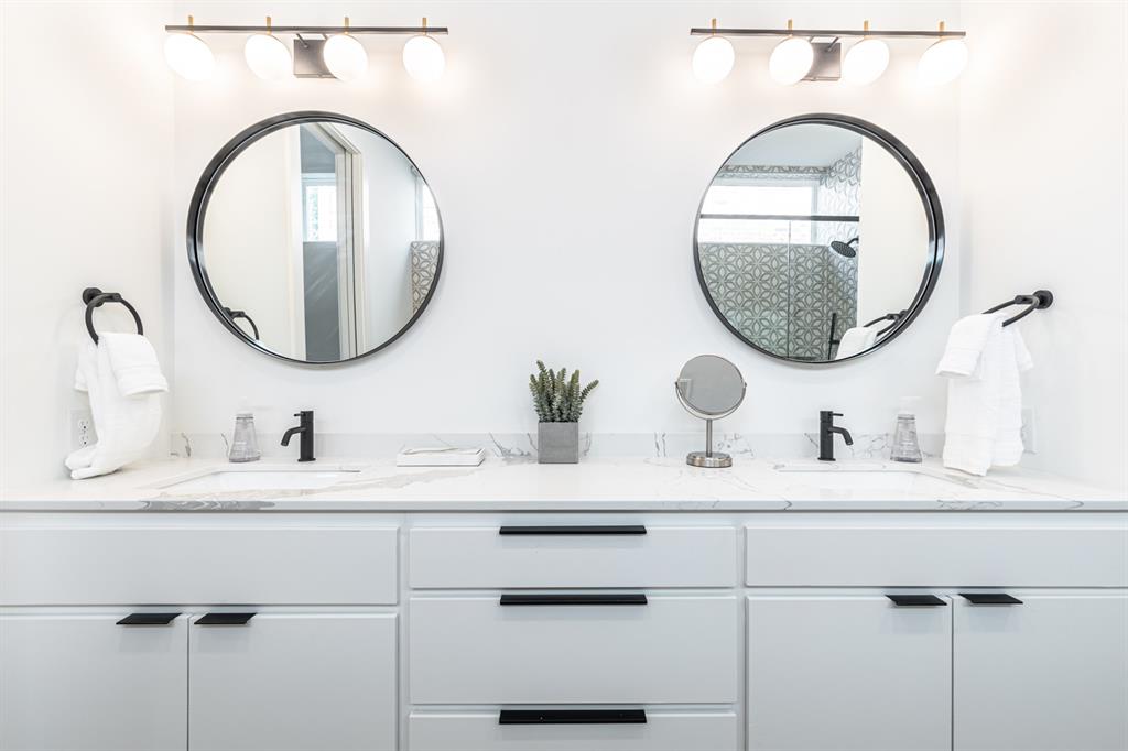 4202 Bonham Street Dallas, TX 75229 - Photo 15 of 32 Full bath with double vanity, plenty of natural light, and a shower