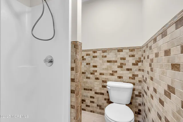 a bathroom with a sink a toilet and bathtub