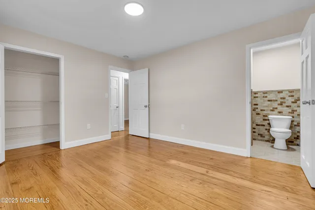 a bathroom with a glass shower door