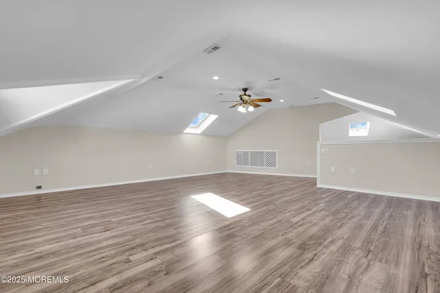 a view of a house with backyard and a garden