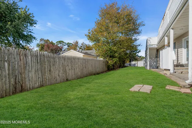 an aerial view of a house with a garden and plants