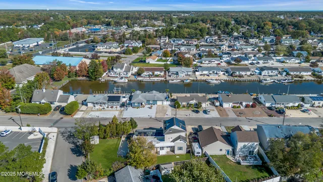 a front view of a house with a garden and deck