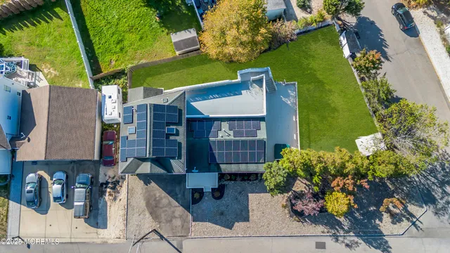 a view of a backyard with large trees