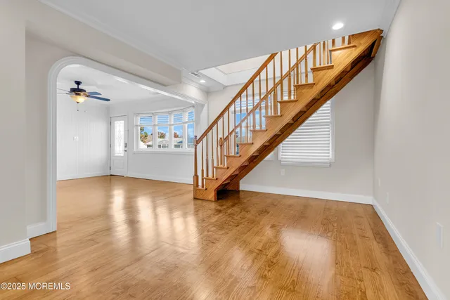 a kitchen with cabinets stainless steel appliances and a window