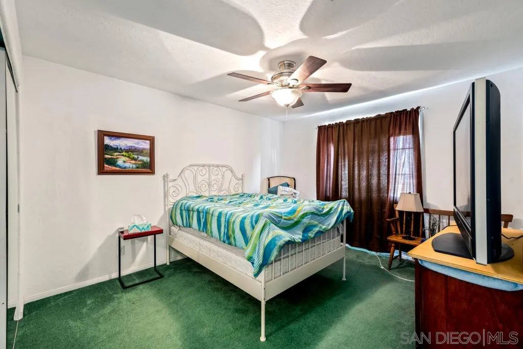 3489 Lakeview Drive Spring Valley, CA 91977 - Photo 11 of 50 a bedroom with a bed window and a table