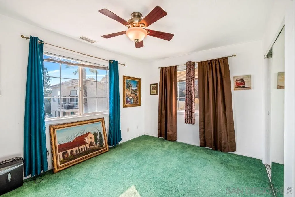 3489 Lakeview Drive Spring Valley, CA 91977 - Photo 13 of 50 a view of an empty room with a window and a fireplace