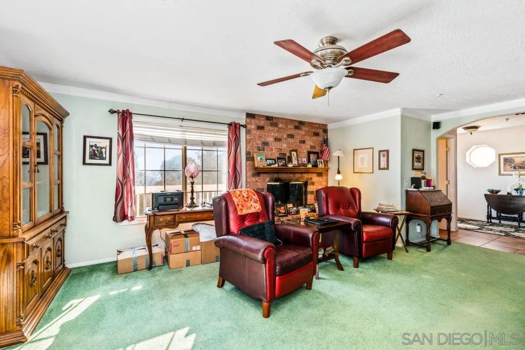 3489 Lakeview Drive Spring Valley, CA 91977 - Photo 21 of 50 a living room with furniture and a fireplace