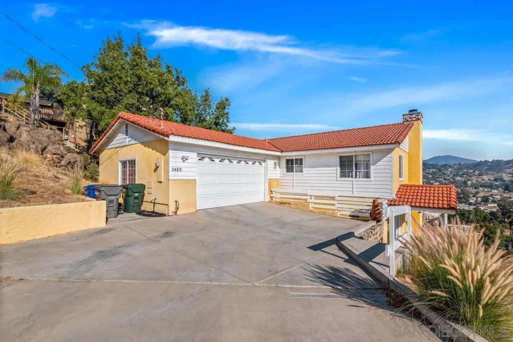 3489 Lakeview Drive Spring Valley, CA 91977 - Photo 3 of 50 a view of house with backyard and a tree