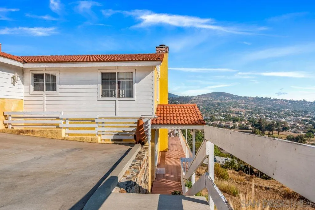 3489 Lakeview Drive Spring Valley, CA 91977 - Photo 4 of 50 a view of a balcony with wooden floor and a floor to ceiling window