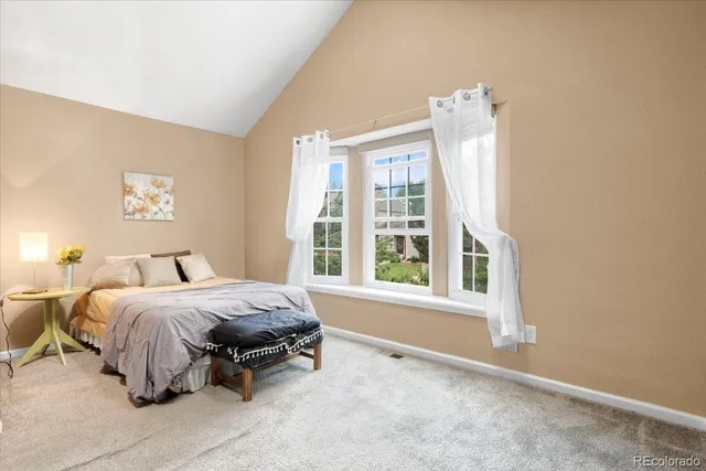 a bed room with a bed and a window