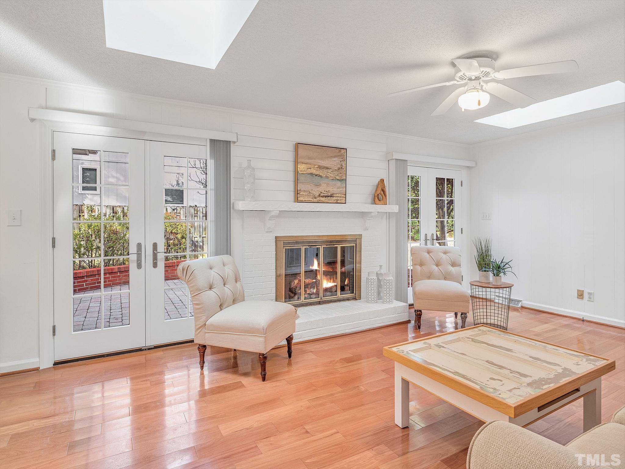 1509 Windbur Place Raleigh, NC 27609 - Photo 11 of 39 a living room with furniture and a fireplace