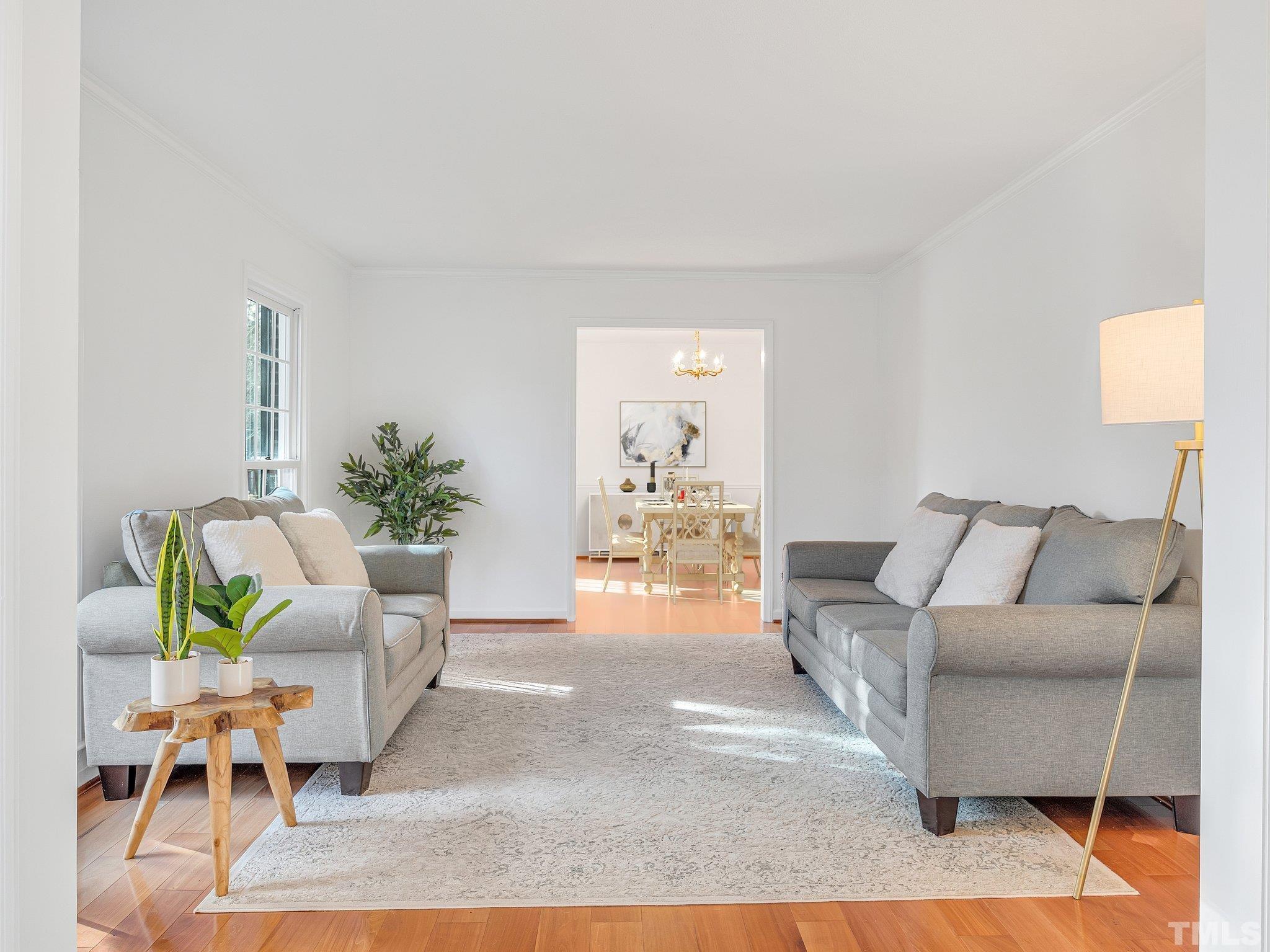 1509 Windbur Place Raleigh, NC 27609 - Photo 19 of 39 a living room with furniture and a wooden floor
