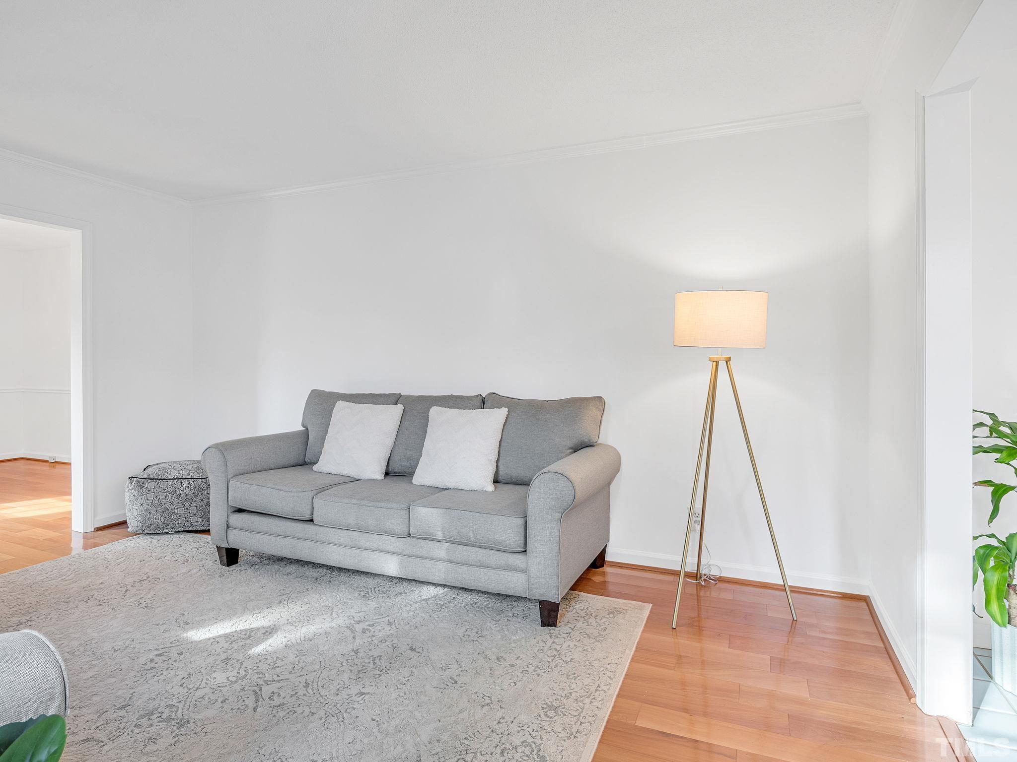 1509 Windbur Place Raleigh, NC 27609 - Photo 21 of 39 a living room with furniture and a wooden floor