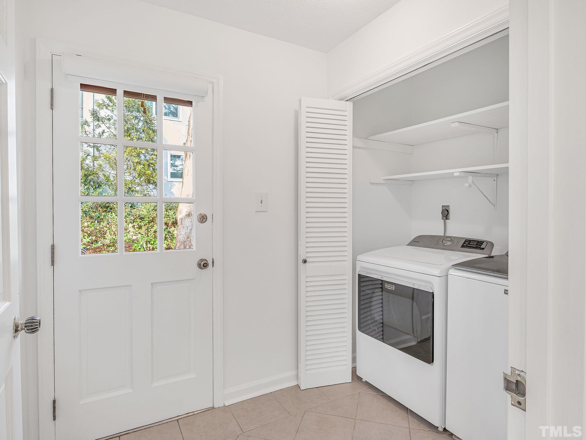 1509 Windbur Place Raleigh, NC 27609 - Photo 32 of 39 a utility room with a stove and a window
