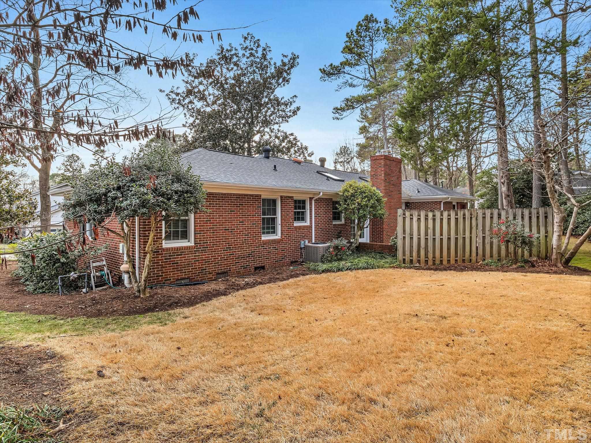 1509 Windbur Place Raleigh, NC 27609 - Photo 33 of 39 a view of a house with a yard