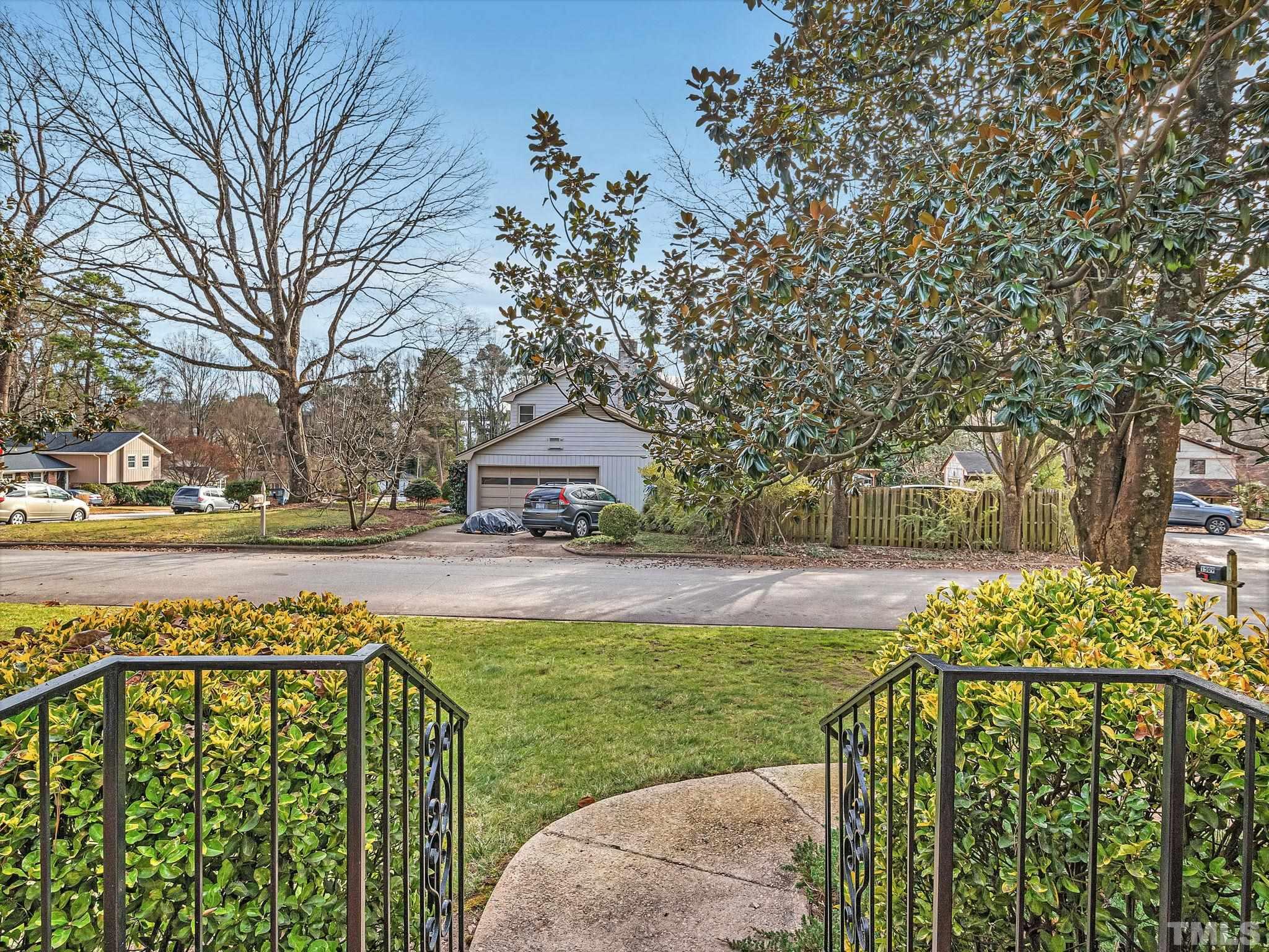 1509 Windbur Place Raleigh, NC 27609 - Photo 4 of 39 a view of a garden with trees