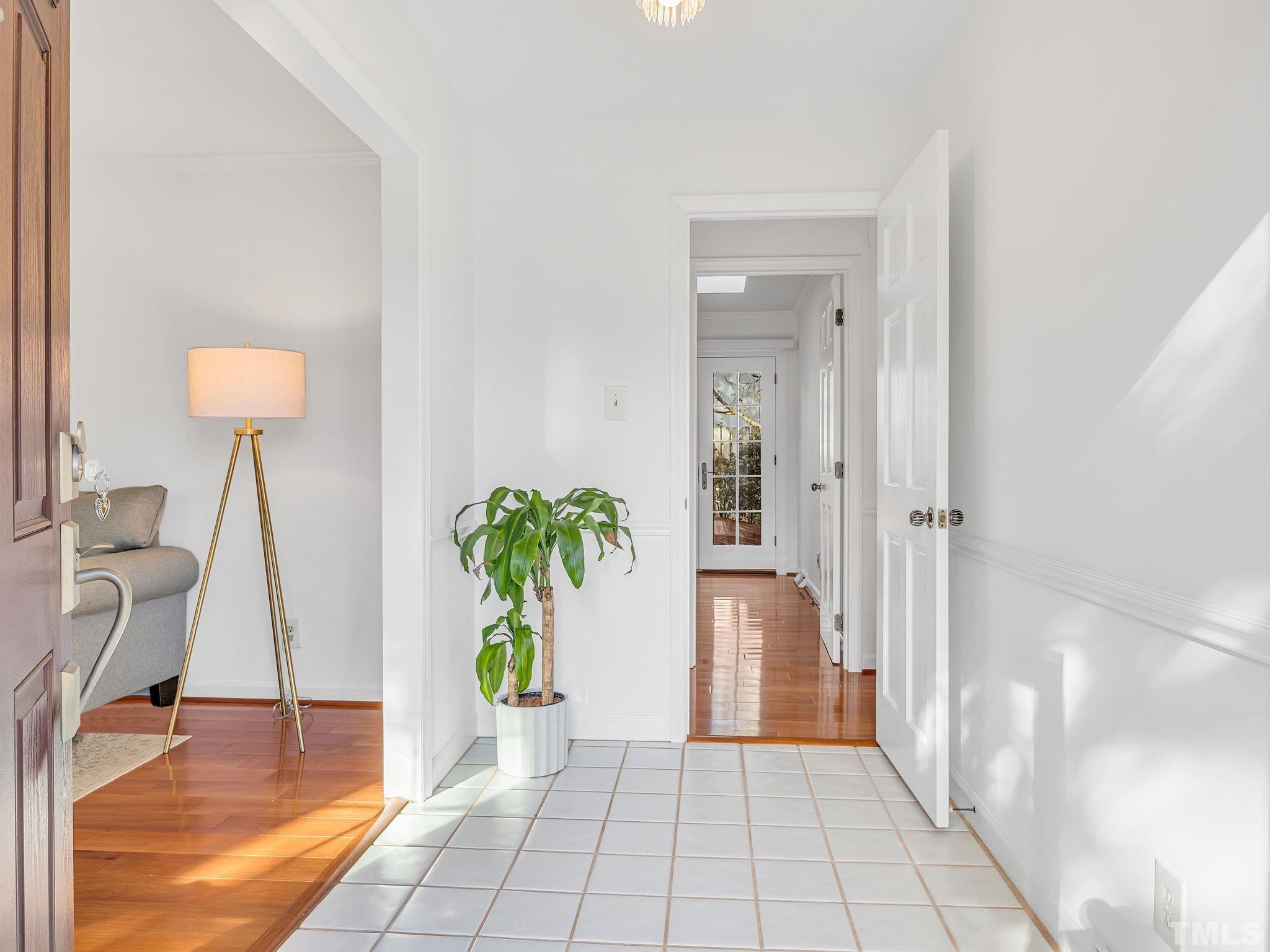 1509 Windbur Place Raleigh, NC 27609 - Photo 5 of 39 a view of an entryway with wooden floor and a rug