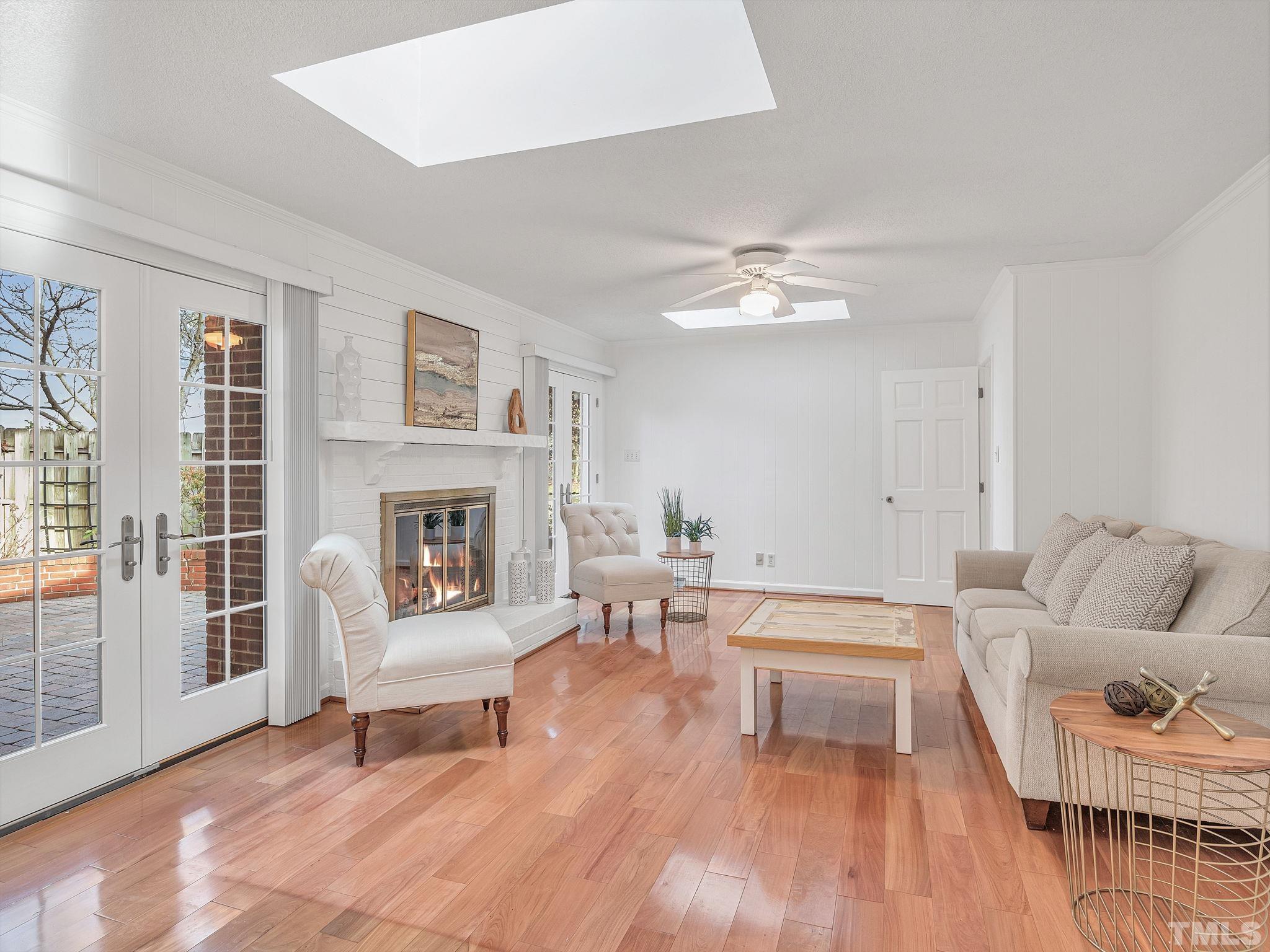 1509 Windbur Place Raleigh, NC 27609 - Photo 10 of 39 a living room with furniture and a fireplace